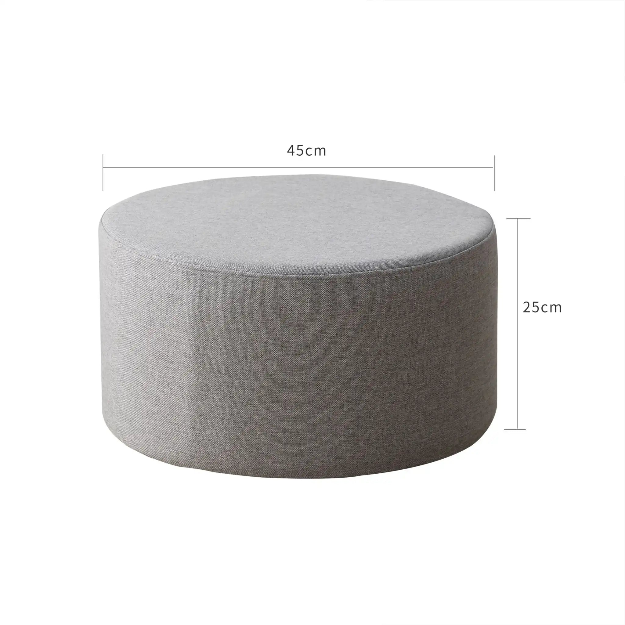 Round gray footrest ottoman in padded fabric