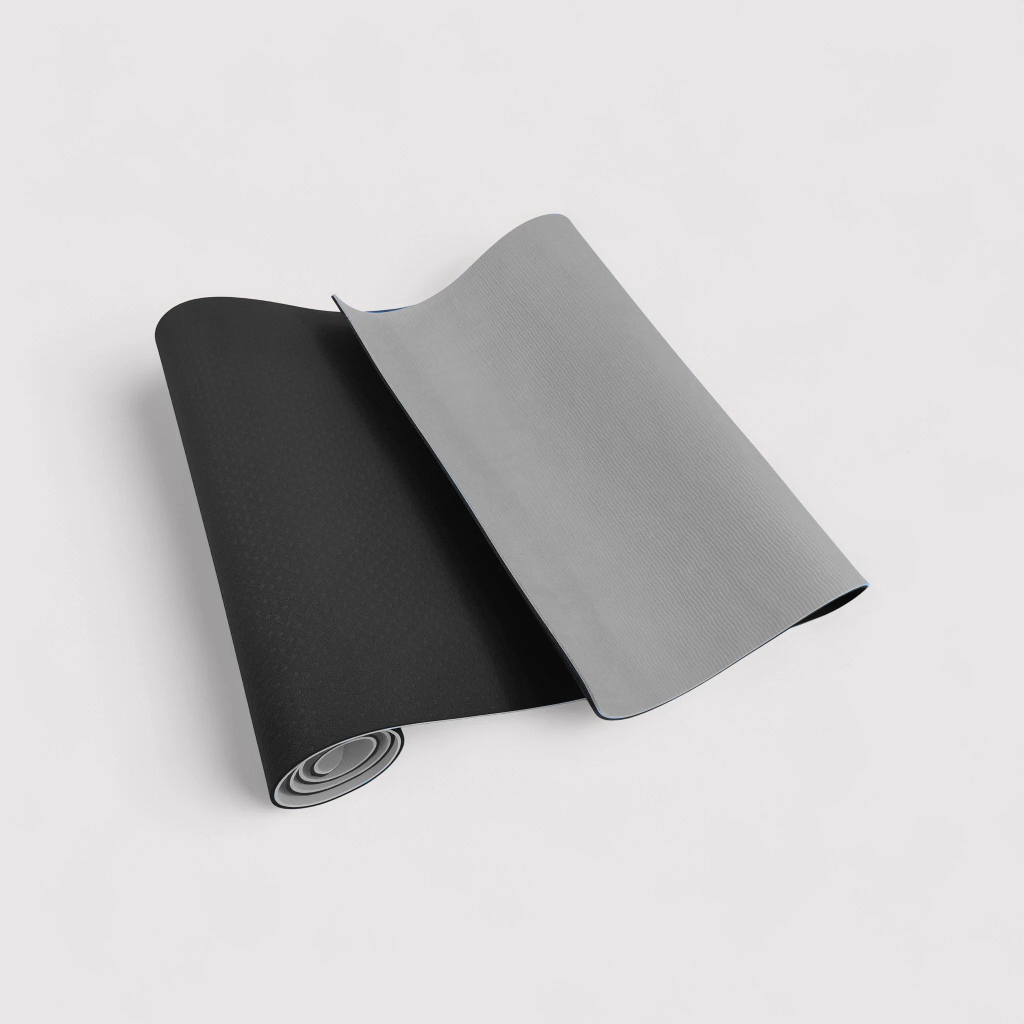 Non-slip black and gray yoga mat for home or outdoor use