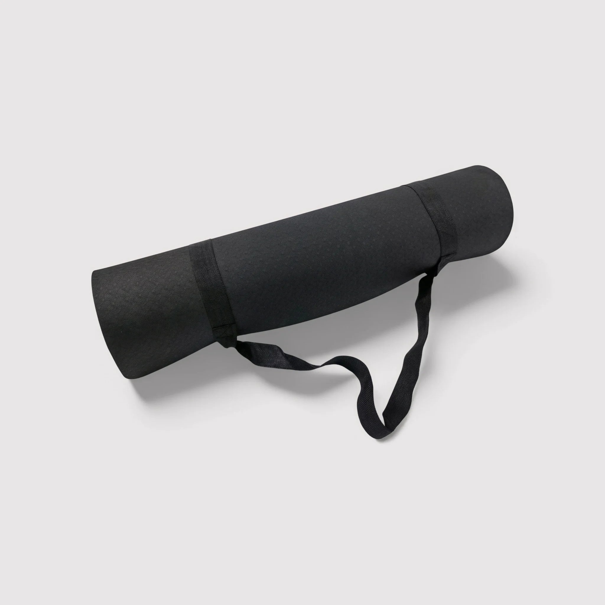 Non-slip black and gray yoga mat for home or outdoor use