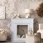 White decorative fireplace frame in...