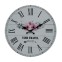 White hanging clock with flower motif