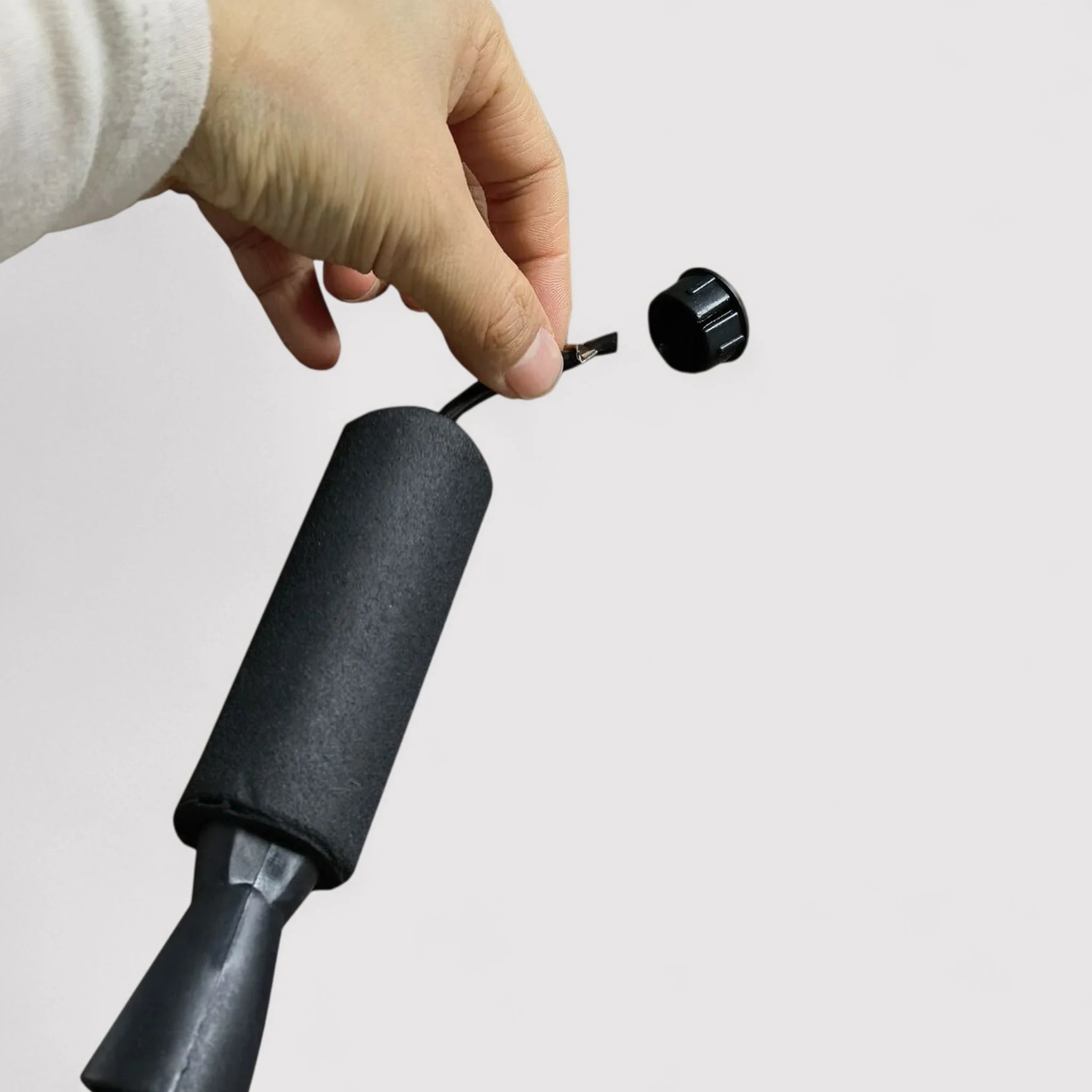 Black jumping rope with ergonomic handles